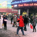 Times Square visitors dont seem to mind the snow.jpg