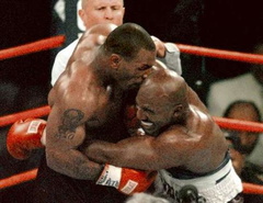 Mike Tyson bites a part of Evander Holyfields' ear lobe off