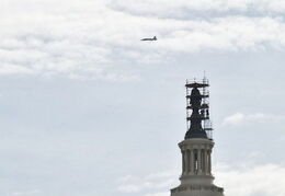 Space Shuttle over the capital building