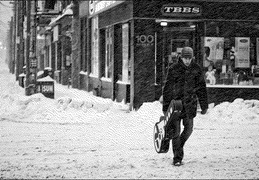 Walking with guitar in the snow